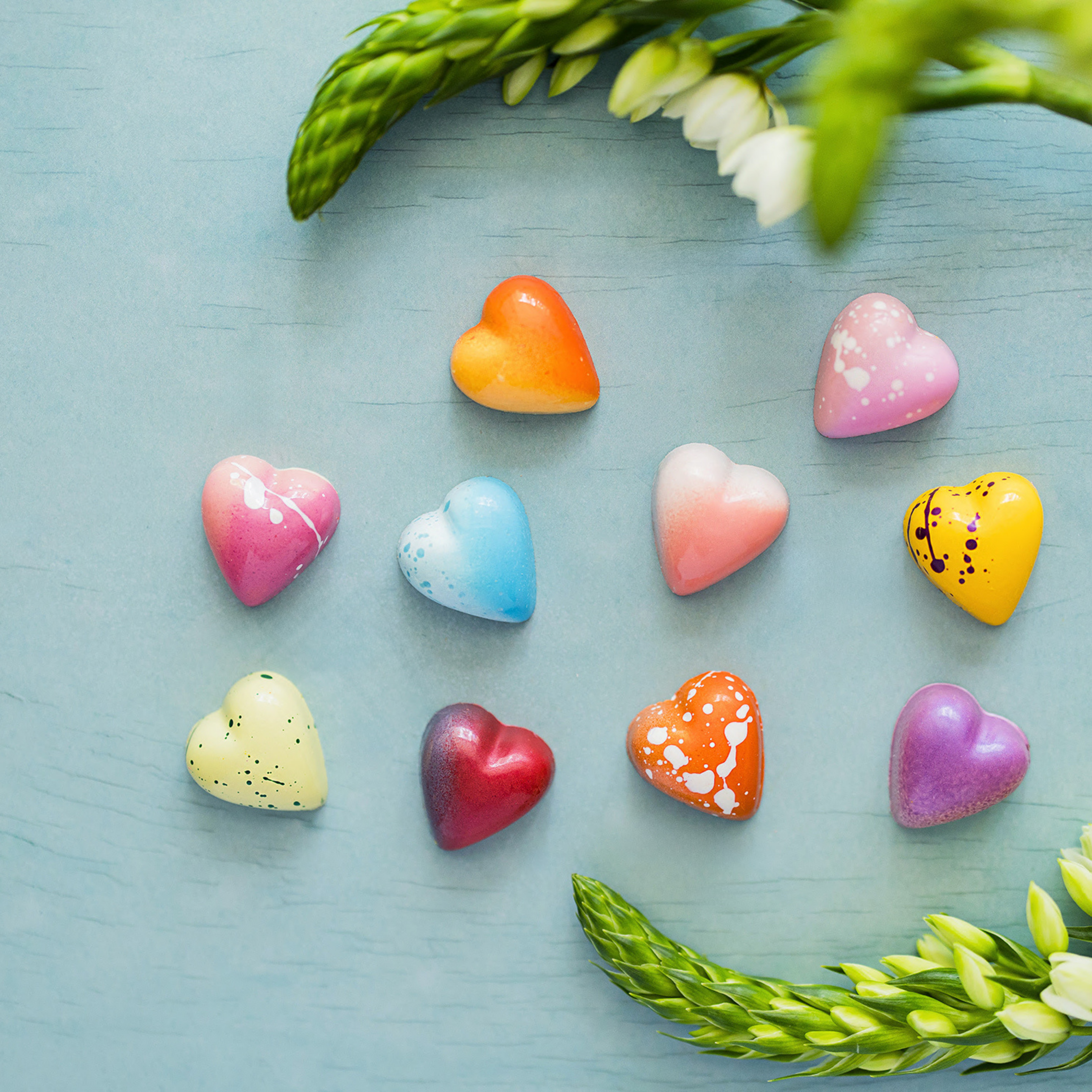 12 count heart-shaped truffles on multi-colored background. 